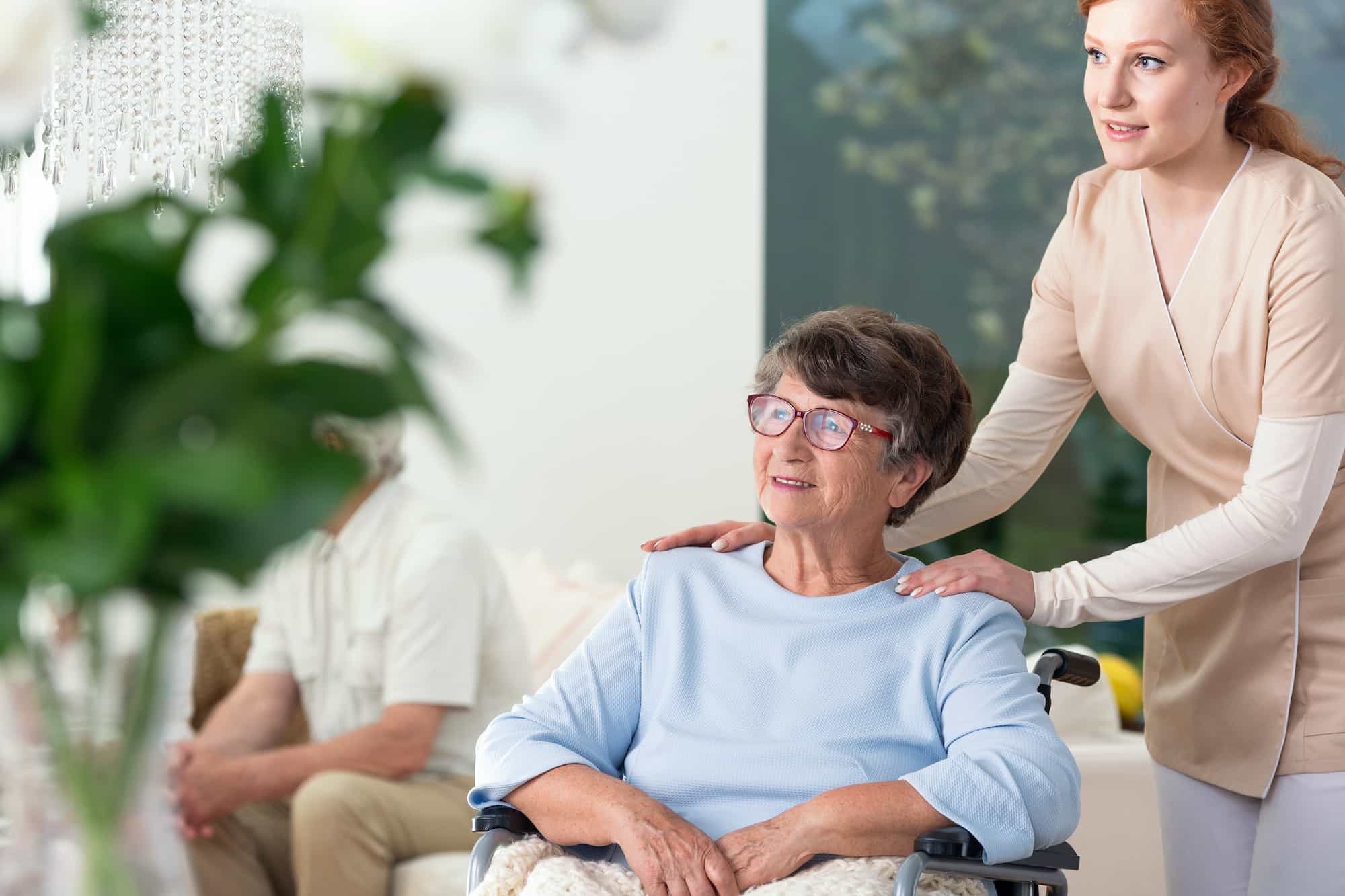 caregiver taking care of disabled elderly woman in 2021 08 26 15 45 40 utc