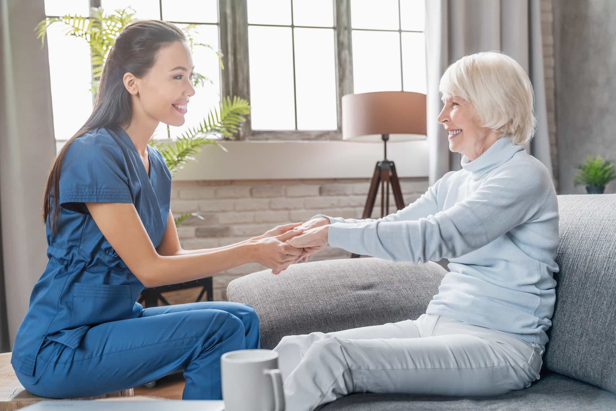 assisting senior people female caregiver holding 2022 05 31 02 21 32 utc 1